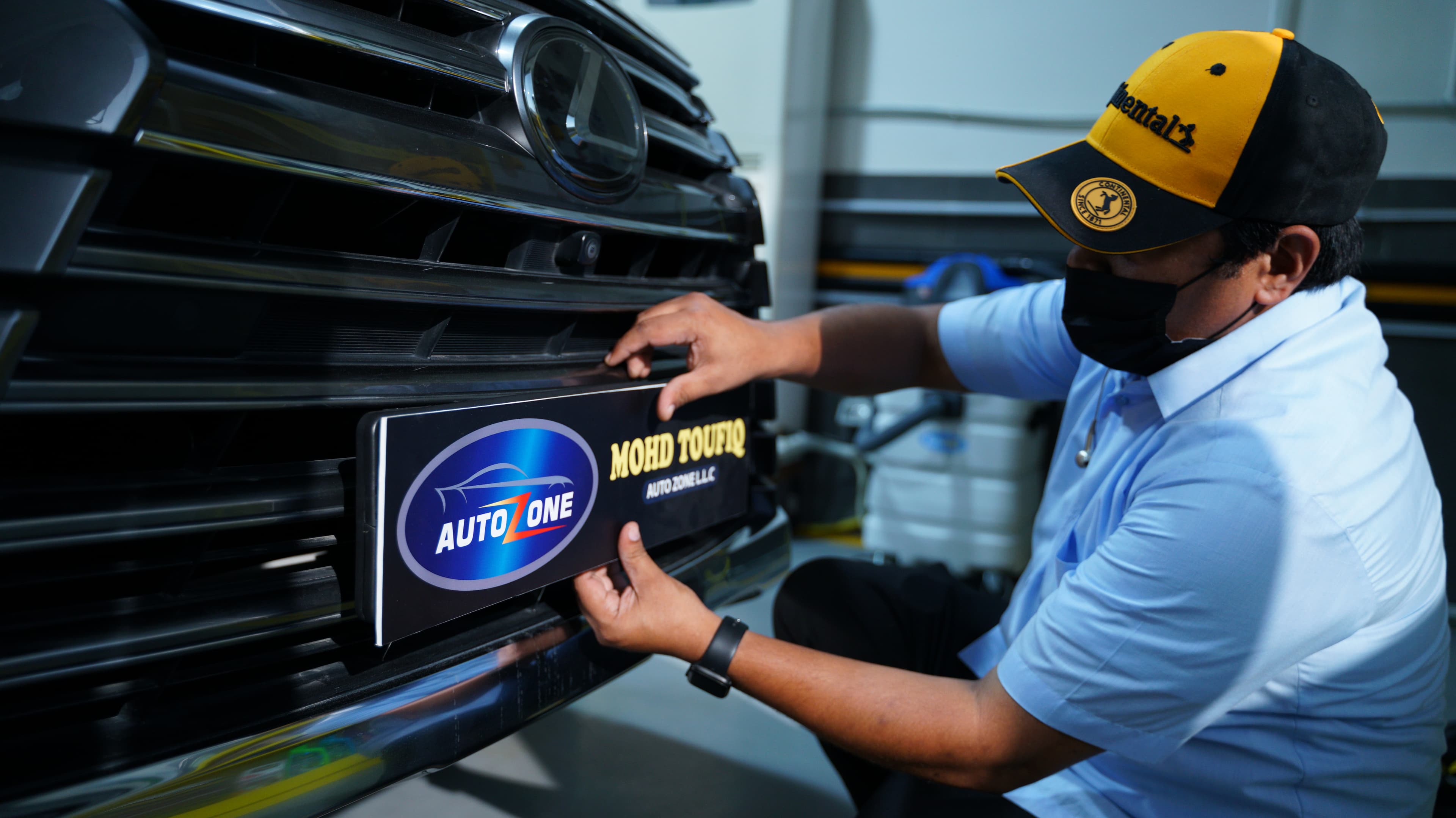M.T. Autozone technician detailing a vehicle
